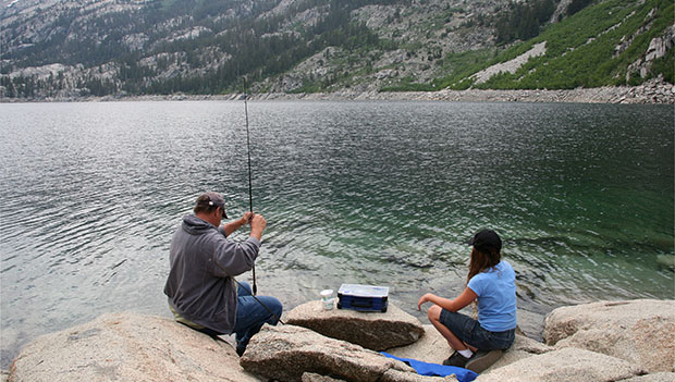 Father and daughter fishing in a High Sierras lake